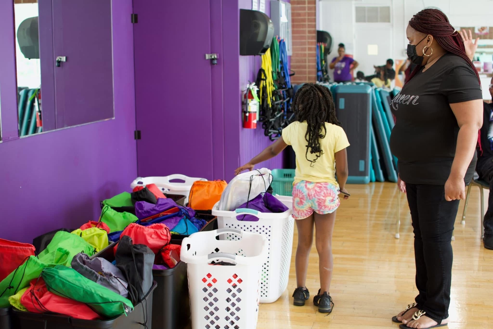 Kids selecting backpacks